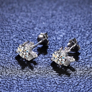 Macro shot of 925 sterling silver moissanite stud earrings with a six-prong crown setting