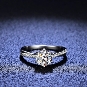 Elegant moissanite silver ring with intertwined band and classic six-prong setting