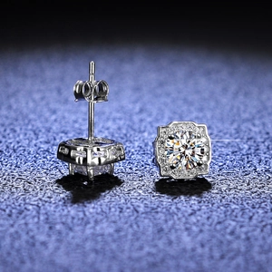 Macro shot of S925 silver square earrings showing brilliant round cut center stone and halo