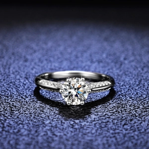 Classic six-prong moissanite engagement ring in sterling silver with side stones