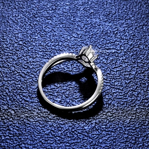 Elegant princess crown moissanite silver ring featuring round cut center stone and pave accents