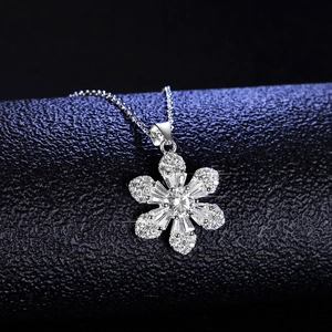 925 silver snowflake necklace with 1ct moissanite pendant on black leather stand