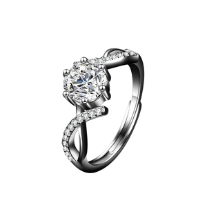 Macro shot of silver bypass moissanite ring with six-prong setting and adjustable band