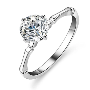 Bamboo style silver ring with a round brilliant cut solitaire moissanite in 4-prong setting