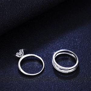 Classic 925 sterling silver moissanite ring set with a six-prong solitaire and dual eternity bands
