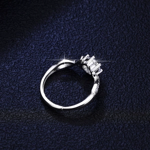 Moissanite silver ring featuring round center stone and pave setting with adjustable band