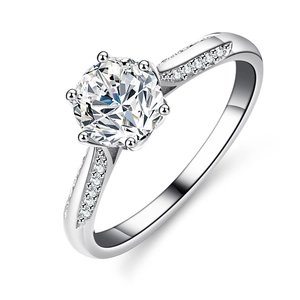 Classic six-prong round moissanite ring in 925 sterling silver with pavé diamond band