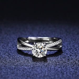 Elegant six-prong moissanite ring with crossover band and sparkling diamond accents
