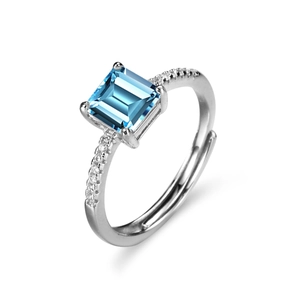 Adjustable sterling silver ring with rectangular blue topaz and moissanite accents