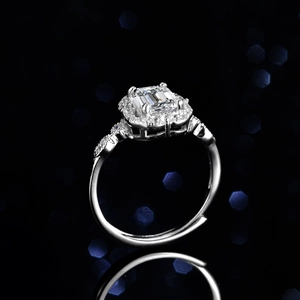 Emerald cut natural blue topaz ring with diamond halo on silver band and mirror reflection