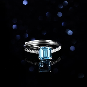 Blue Topaz sterling silver ring with rectangular princess cut and pavé diamonds