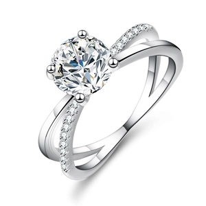 Elegant six-prong moissanite ring with a silver crossover band and pavé diamonds
