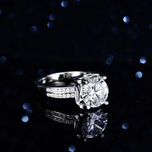 Classic 3ct moissanite S925 silver engagement ring with pavé side stones on black background