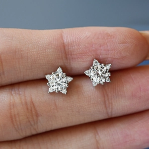 Star-shaped S925 sterling silver moissanite stud earrings with brilliant sparkle and pavé edges
