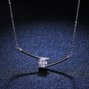 S925 sterling silver necklace with 1 carat moissanite pendant on a dark background