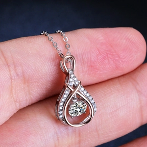 925 silver water drop pendant necklace with dancing moissanite and rose gold accents