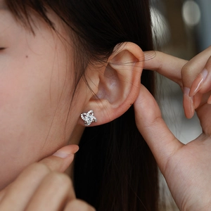 Sparkling silver four-leaf clover moissanite stud earrings for an elegant daily look