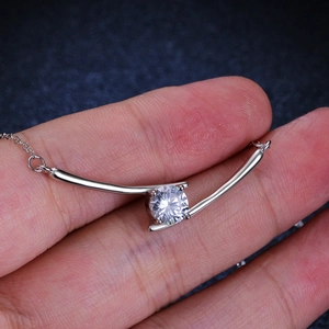 S925 sterling silver necklace with a 1 carat round moissanite in a cross curve pendant