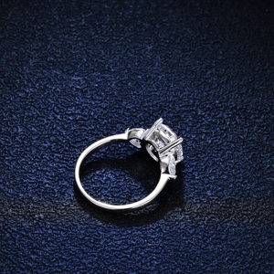Classic 3-carat moissanite ring with four-prong setting on a blue leather base