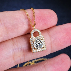 Golden 925 silver key lock necklace with 1-carat moissanite and micro-pave diamonds