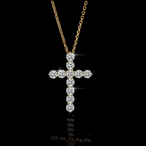 Macro shot of 925 silver cross pendant with brilliant round-cut moissanite in gold