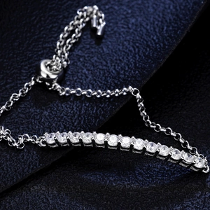 Adjustable 925 silver moissanite tennis bracelet with slider bolo clasp on blue leather