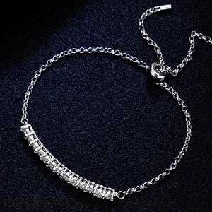 925 silver moissanite tennis bracelet with adjustable sliding buckle on blue texture