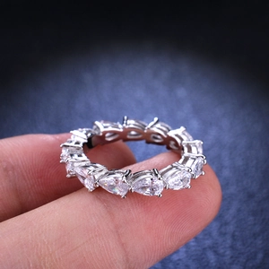 Sparkling S925 silver eternity ring with pear-shaped moissanite stones in a prong setting