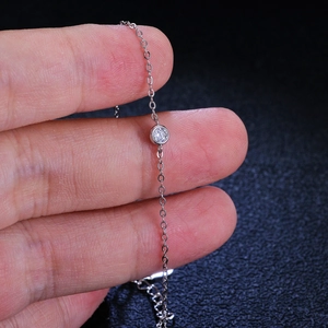 925 silver minimalist bezel set moissanite bubble bracelet shown on a hand