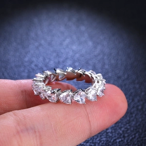 Elegant S925 silver eternity ring featuring multi-heart cut white moissanite stones