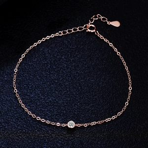 925 silver moissanite bubble bracelet in rose gold with adjustable chain on blue fabric