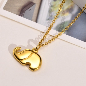 Detailed view of 3D elephant pendant in gold stainless steel on a delicate link chain