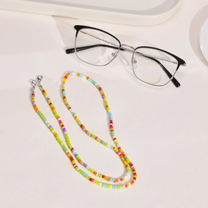 Detailed macro of colorful beaded eyeglass chain with secure silver lobster clasp