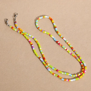 Detailed macro view of colorful rainbow beads chain with silver lobster clasps for eyewear