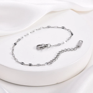 Close-up of silver stainless steel chain bracelet with lobster clasp and extension