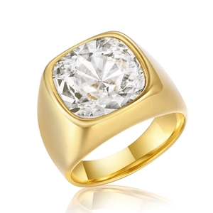 Polished gold stainless steel ring with square cut white glass stone on white background