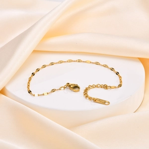 Detailed macro of 18K gold stainless steel chain with lobster clasp and extension