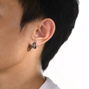 Black stainless steel viking rune hoop earrings for men with punk minimalist aesthetic