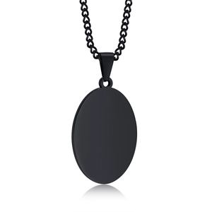 Close-up of matte black stainless steel oval pendant with elegant cuban curb chain