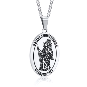 Macro detail of Saint Christopher oval pendant showing engraved figure and protect us text