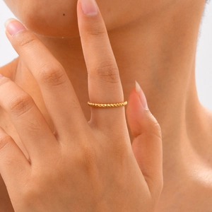 Elegant gold geometric textured ring for women with minimalist faceted diamond cut design