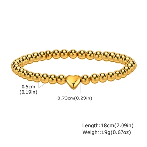 Detailed view of 18cm gold beaded bracelet with 0.73cm heart charm and size markings
