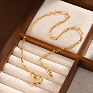 Detail of 18K gold stainless steel paperclip chain necklace with large round spring clasp