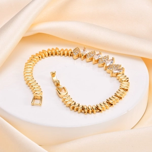 Detailed view of luxury gold Cuban chain bracelet with marquise-cut cubic zirconia crystals