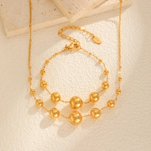 Parure de bijoux en or 18 carats avec perles dégradées, collier et bracelet polis brillants