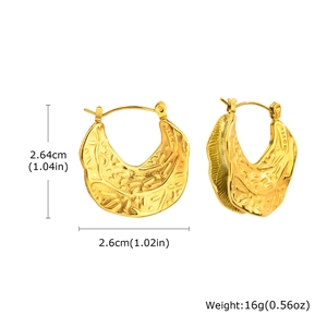 Detail view of irregular hammered C-shaped gold earrings with precise size measurements