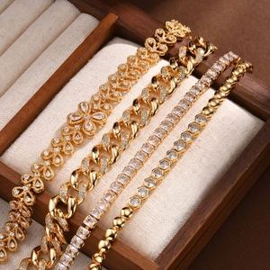 Luxurious gold-plated tennis bracelets set with sparkling zircons on jewelry box