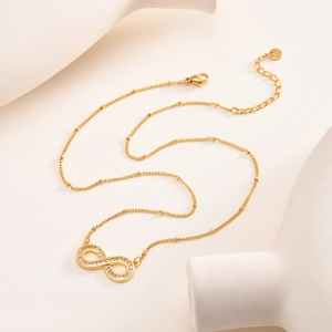 Infinity symbol necklace in 14K gold plated stainless steel with white zircon stones