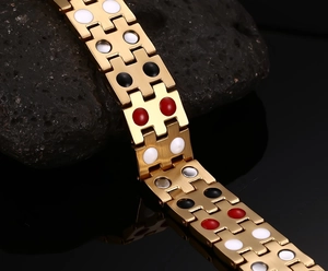 Detail of gold magnetic stainless steel link bracelet with colorful inlay stones