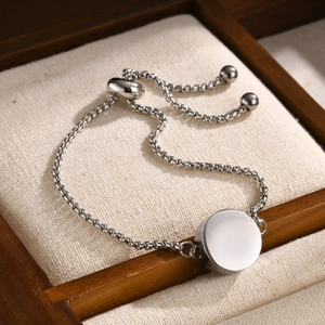 Polished stainless steel adjustable chain bracelet with round locket pendant for women
